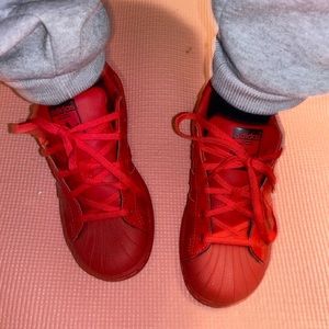 Red adidas kid shoe
